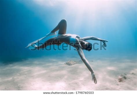 Attractive Woman Freediver Glides Posing Over Stock Photo