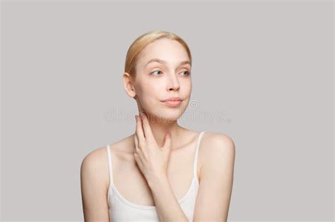Gorgeous Woman Touching Her Neck Isolated On Grey Background Beauty