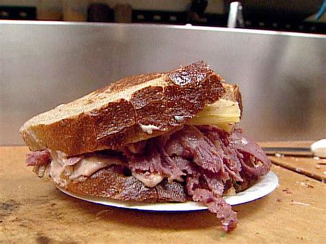 The reuben sandwich is an american grilled sandwich composed of corned beef, swiss cheese, sauerkraut, and russian dressing, grilled between slices of rye bread. Zingerman's Reuben Sandwich Recipe | Food Network