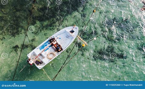 Aerial View Of Small Finish Boat Floating In Open Sea Stock Photo