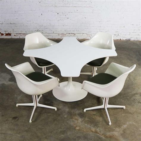 The strong points of its design have always been the sobriety and purity of the shapes, so here are the calyx bases in fusion of aluminum and the marble tops to which over time. Mid-Century Modern Burke Tulip Game Table and 4 Fiberglass ...