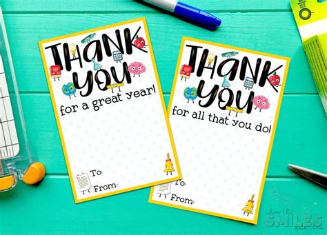 Two Thank You Note Cards Sitting On Top Of A Table Next To Pens And Pencils