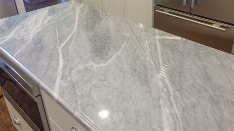 Quartz stone countertops have recently exploded in popularity and are quickly becoming a favorite surface for use in kitchen and bath applications. Sparkling Blue Marble and Clamshell Quartz Kitchen ...