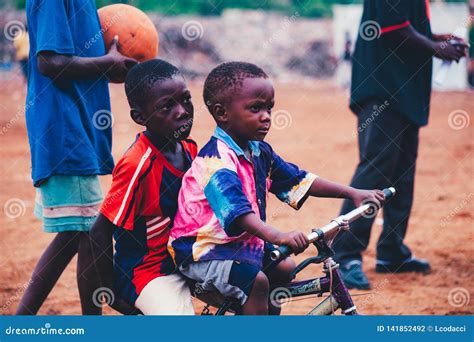 Black African Children Playing Soccer In A Rural Area Editorial
