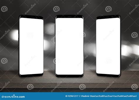 Three Mobile Phones With Screen For Mockup On The Table Stock Image