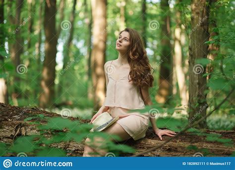 Beautiful Sensual Woman In Forest Meadow With Flower Stock Image