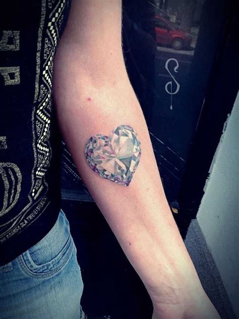 A Heart Shaped Diamond Tattoo On The Arm