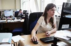 candid office desk her worker real sitting footage dressed smartly concentrates monitor beginning reading female type she before