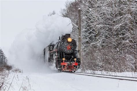 Old Steam Locomotive Locomotive By Rail In The Winter In The Woods