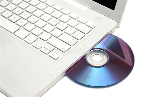 White Laptop With Dvd Disk In Slot Isolated Royalty Free Stock Photo