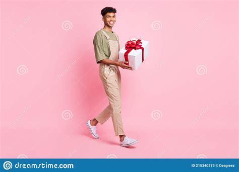 African American Walking Carrying Present Stock Photos Free And Royalty