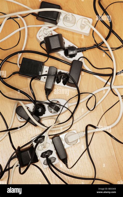 Tangled Cables And Extension Cords On The Floor Stock Photo Alamy