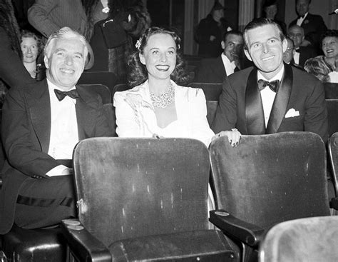 charlie chaplin with his wife paulette goddard and tim durante at the new york premiere of the