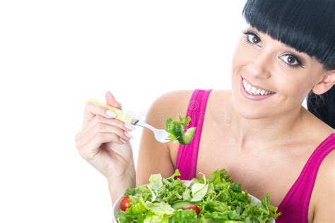 Healthy Young Woman Eating Fresh Salad Leaves With Tomato Stock Photo