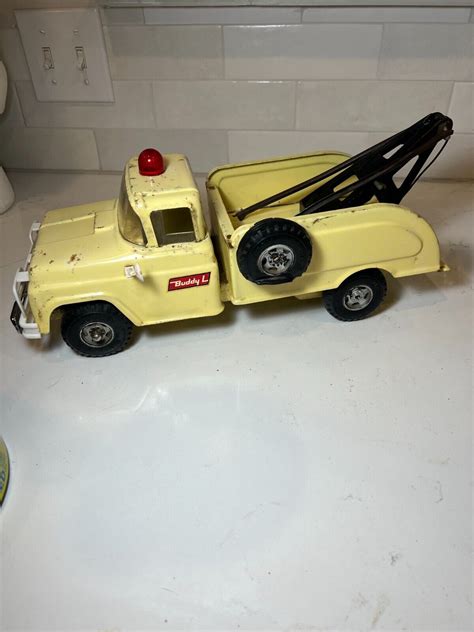mavin vintage buddy l tow truck wrecker 1960s yellow pressed steel toy truck flat tire