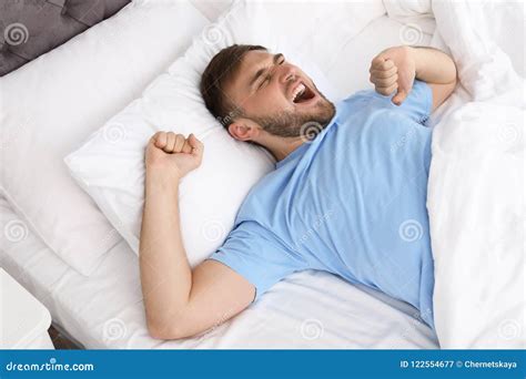 Young Happy Man Waking Up After Sleeping Stock Image Image Of Cozy