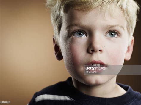 Portrait Of A 4 Year Old Boy Looking Up High Res Stock Photo Getty Images