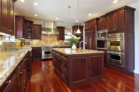 Wood cabinets are generally more expensive and add more to the value of your home, but laminates offer a greater variety of designs and are easier to clean. 23 Cherry Wood Kitchens (Cabinet Designs & Ideas ...