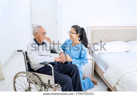 Portrait Friendly Nurse Old Patient Smiling Stock Photo 1700735251