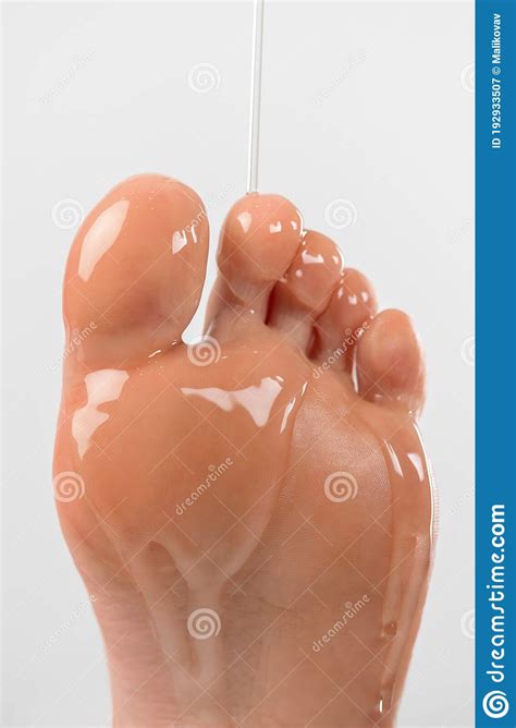 Massage Oil Is Poured On The Toes Of The Girl`s Feet Soft Light Close
