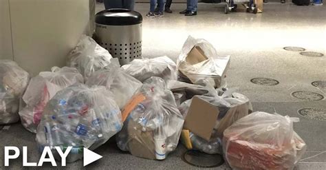 couple sees man at airport crying as he throws a package away then they look inside the trash bin