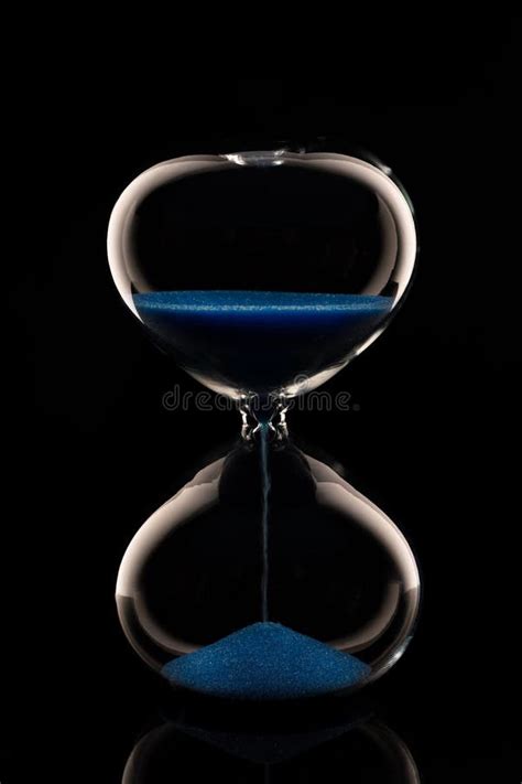 Blue Sand Hourglass On Black Background Stock Photo Image Of Clock