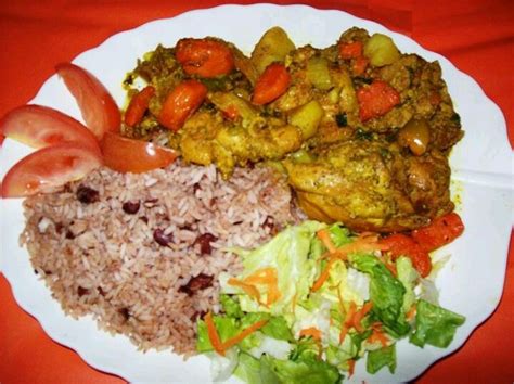 A Beautiful Plate Of Jamaican Curry Chicken Rice And Peas And Salad