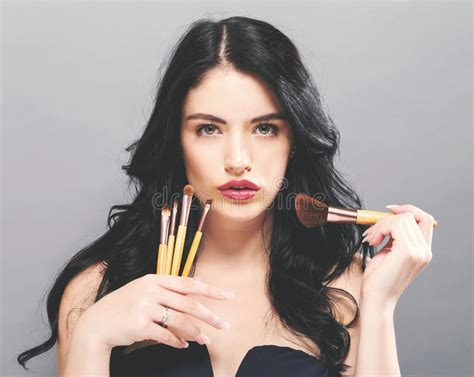 Beautiful Young Woman Holding Makeup Brushes Stock Image Image Of