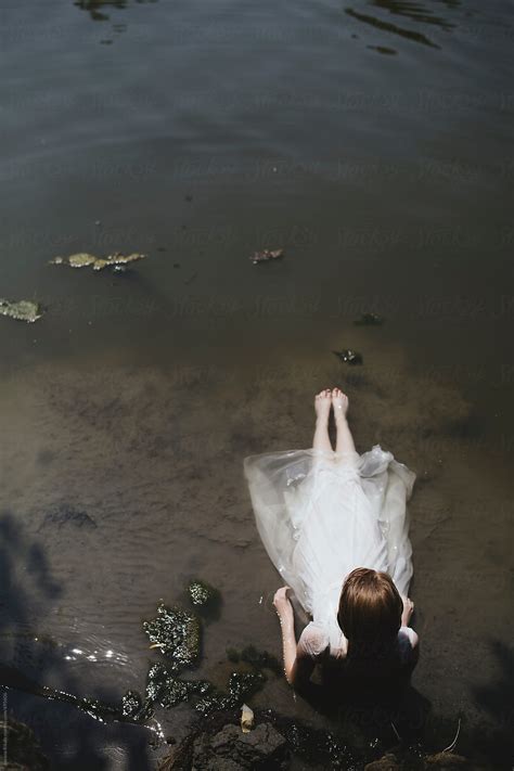 Young Woman In A White Dress In Water By Stocksy Contributor Jovana