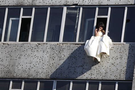 Https://tommynaija.com/wedding/asian Girl In Wedding Dress Hanging Out Window