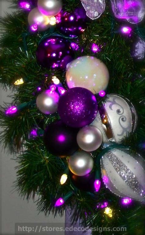 A Christmas Tree With Purple And White Ornaments