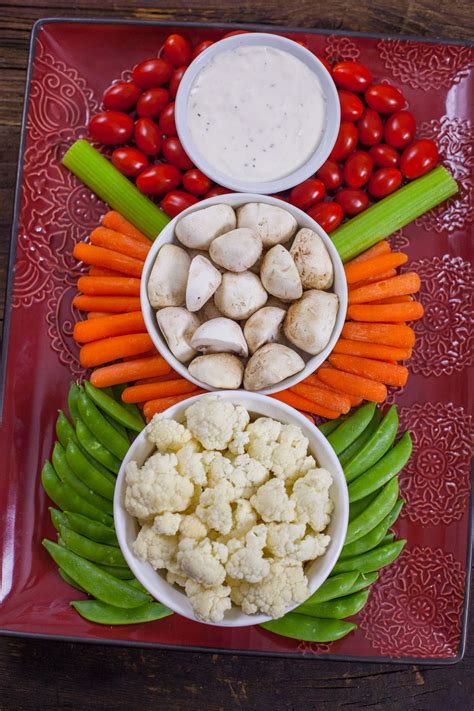 Finger foods are the best for keeping your guests satisfied until the main meal is served. This Christmas Veggie Tray Snowman is easy enough for kids to make, and too cute to resist. It's ...