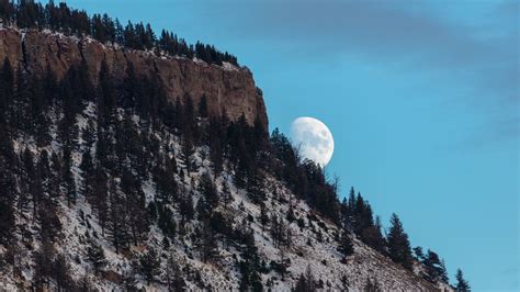 Download Wallpaper 1366x768 Moon Mountain Slope Trees Tablet Laptop