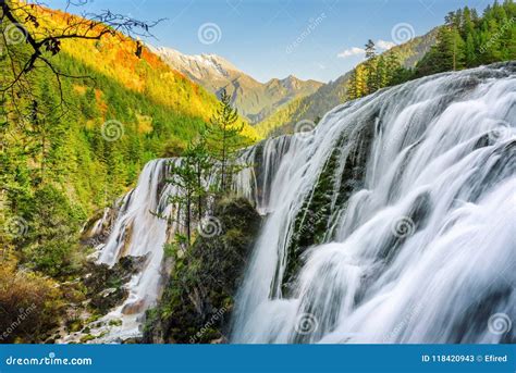 Scenic View Of The Pearl Shoals Waterfall Among Wooded Mountains Stock