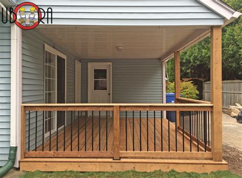 Complete your railing renovation project with the right baluster. Wood Deck with Black Metal Spindle Railings - Deck ...