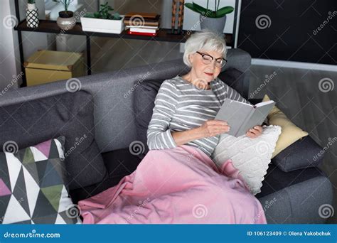 Aged Charming Woman Resting On Sofa With Notebook Stock Image Image Of Home Couch 106123409