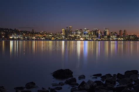 Sunset Over Seattle`s Skyline Creating Reflections In Lake Washington