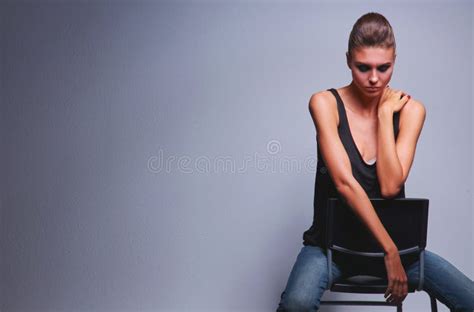 392 Beautiful Woman Black Sitting Chair Isolated Gray Background Stock
