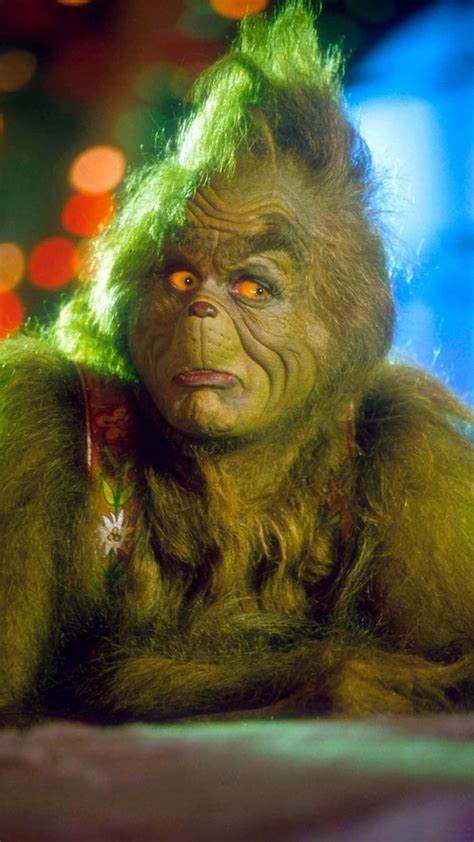 Jim carrey overacts the part of the grinch to perfection. Jim Carrey as "The Grinch" in the 2000 film How The Grinch Stole Christmas in 2020 | Grinch