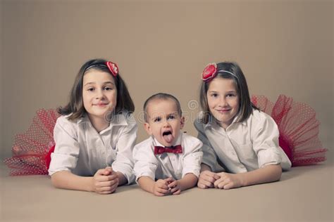 Twin Sisters With Little Brother Stock Photo Image Of Lifestyle