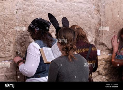 Religious Jewish Woman Wearing Bunny Ears Praying During The Jewish