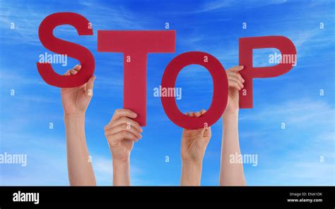 Many People Hands Holding Red Word Stop Blue Sky Stock Photo Alamy