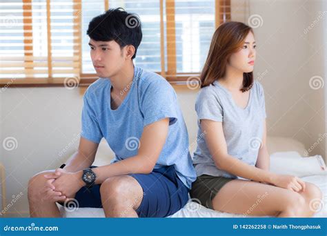 Relationship Of Young Asian Couple Having Problem On Bed In The Bedroom