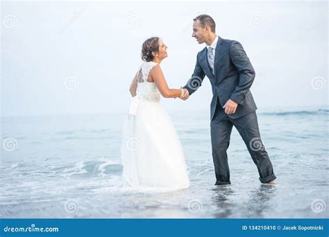 Bride And Groom In Romentic Scenery By The Ocean Stock Photo Image Of