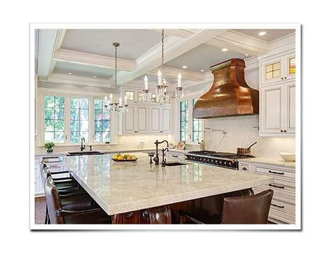 A copper kitchen hood forms the centre of this luxurious white marble kitchen with green accents. Copper Range Hoods | Custom Copper Range Hoods | Copper ...