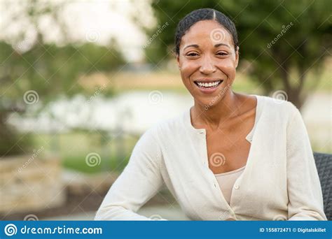 Mature Confident African American Woman Smiling Outside Stock Image Image Of Fall Grass