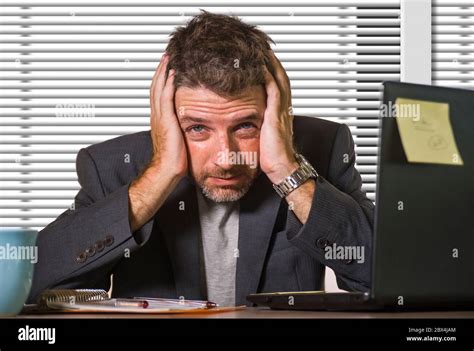 Young Attractive Depressed And Frustrated Businessman Working At Office