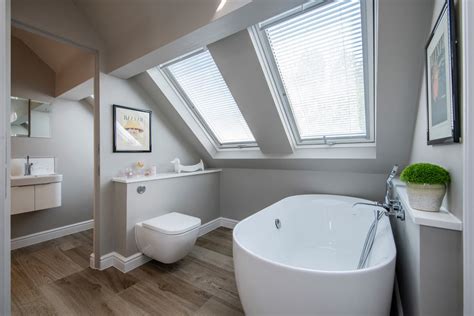 An attic certainly isn't the easiest area of a home to design, particularly due to the strange shape of the roof, lower ceilings, and an overall much more in fact, a bathroom might be just what your attic needs (especially if you lack one on any of the main floors of your house). Sparkling Contemporary Attic Bathrooms Like Bathroom Surrey Residence Sloped Ceiling Velux ...