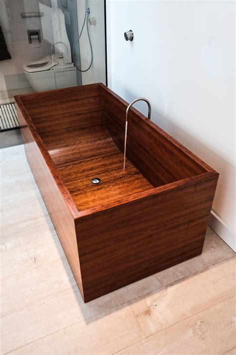 Now, you're in the lap of luxury. Custom Puari wooden bathtub made in cherry. # ...