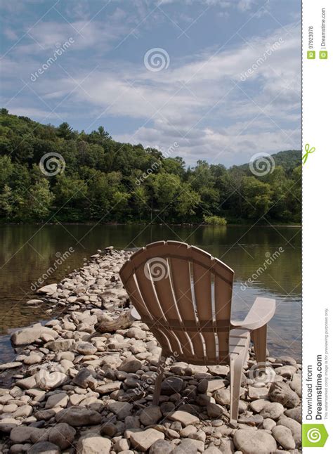 A Single Chair On The River Bank Stock Photo Image Of Pier Distance